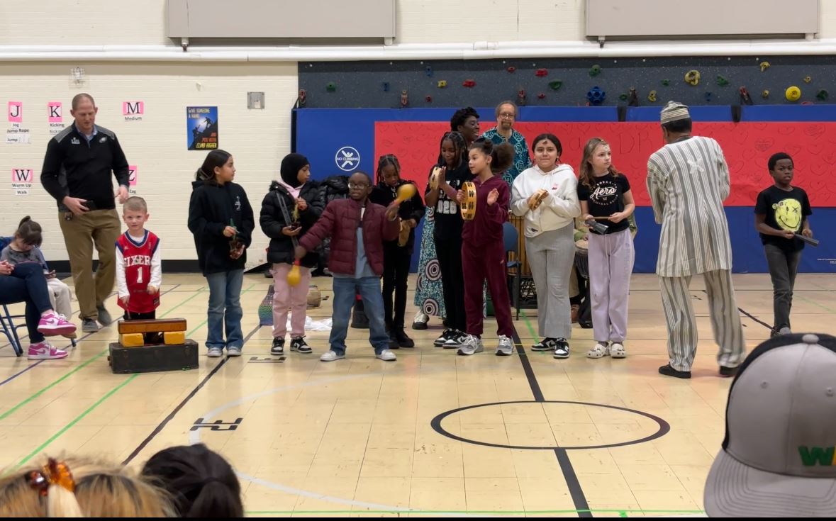  Students playing instruments during our black history month expo.