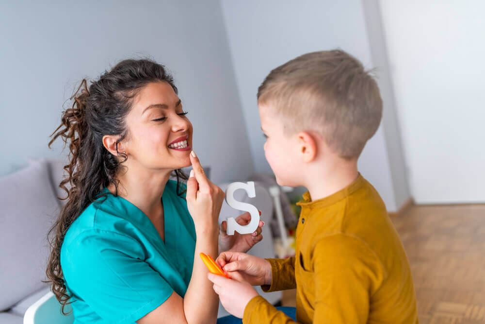 Speech therapist with young child